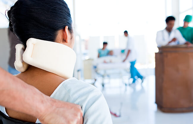 woman at hospital with neck brace