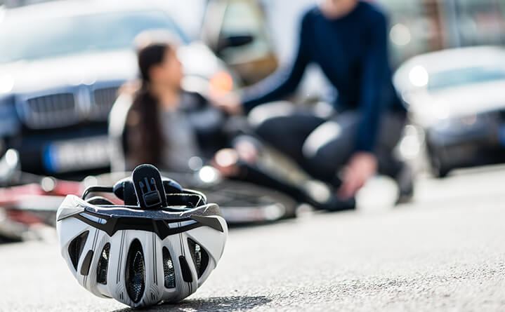 bike helmet with person on ground