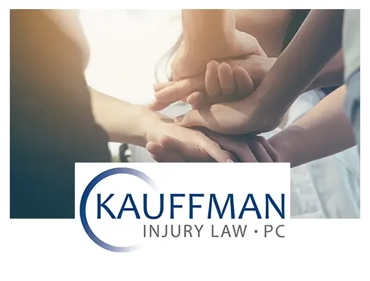 hands together for team work and logo of Kauffman Injury Law