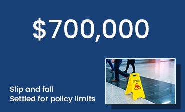 photo of wet floor yellow sign with caption $700,000 - Slip and fall - Settled for policy limits