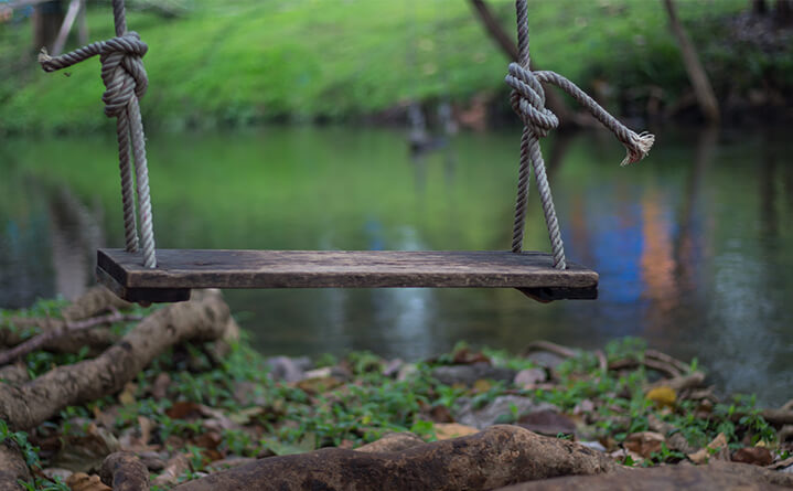 empty swing by river