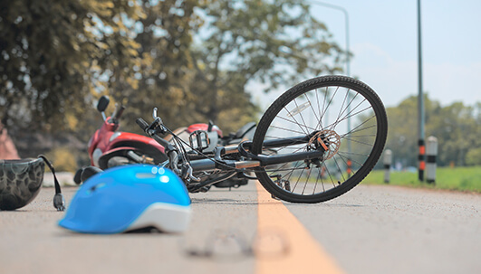 bicycle on ground with helmet after hit and run accident